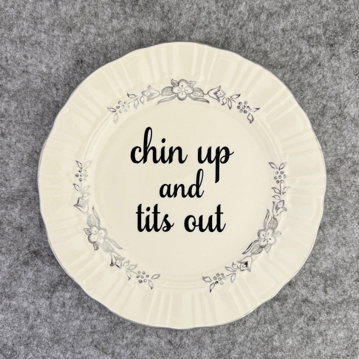 chin up and tits out